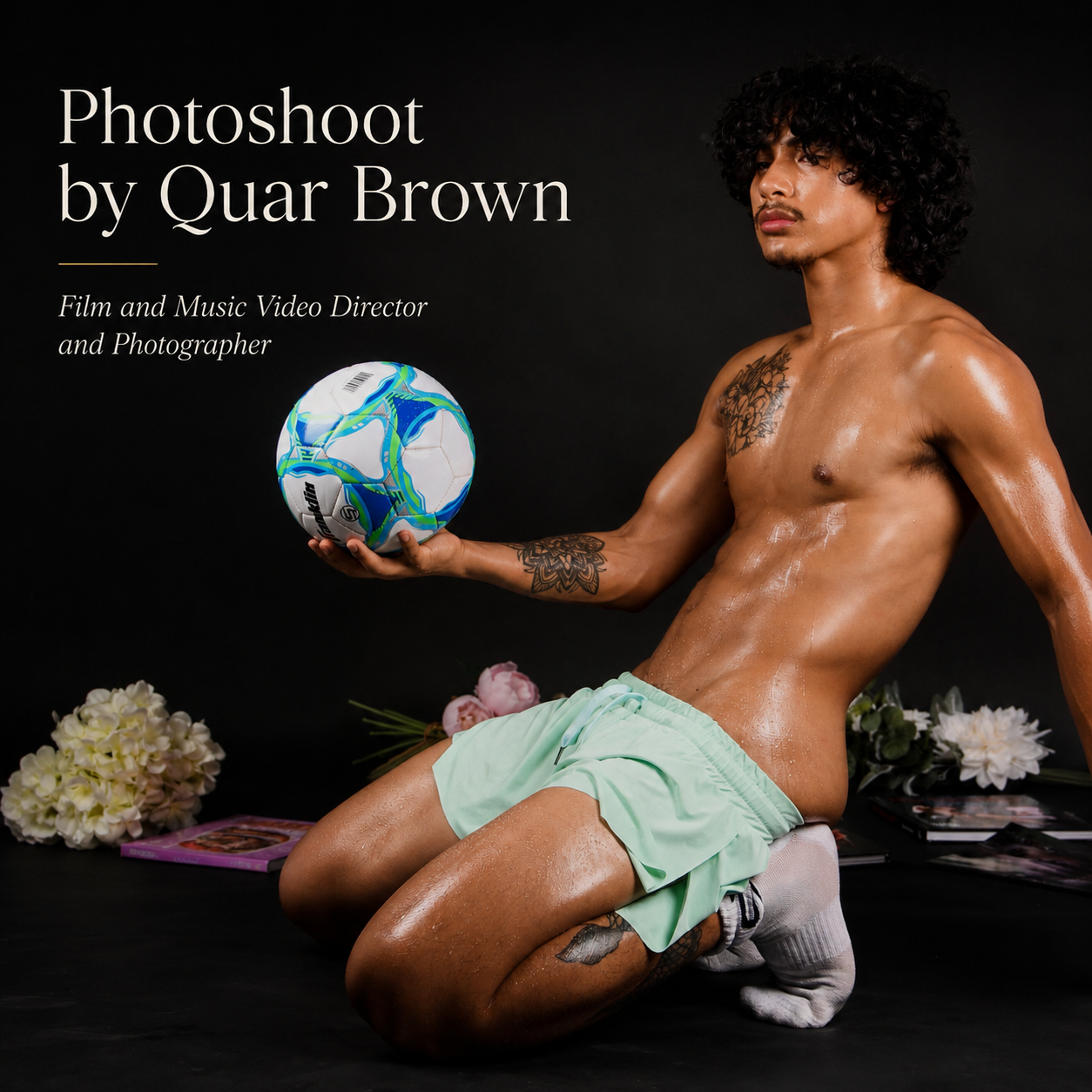 Shirtless male model holding a soccer ball in a studio portrait with text reading “Photoshoot by Quar Brown.”